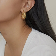 Load image into Gallery viewer, High quality, stainless steel, gold plated earrings on girl.
